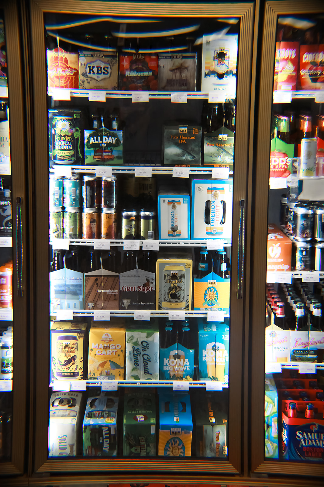Craft beer cooler at Bay Party Store — KBS, All Day IPA, Kona, Samuel Adams and more